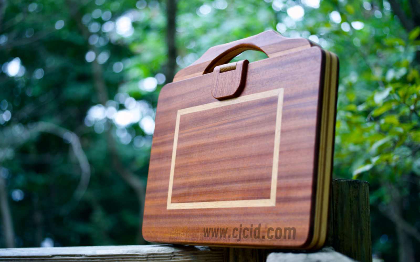 Front view of the handcrafted solid wood attaché case for the 15″ Apple MacBook Pro